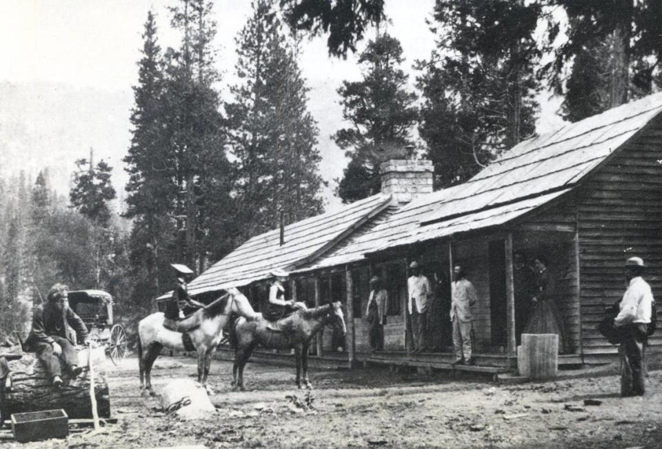 Galen Clark (left) contemplates new arrivals at his hostelry, Clark’s Station, near the site of the present Wawona Hotel about 1866.