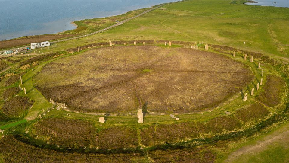 An aerial view shows the wide expanse of the Ring of Brodgar, a massive ceremonial stone circle on Mainland dating back to the third millennium BC. - T Schaeffer/imageBROKER/Shutterstock