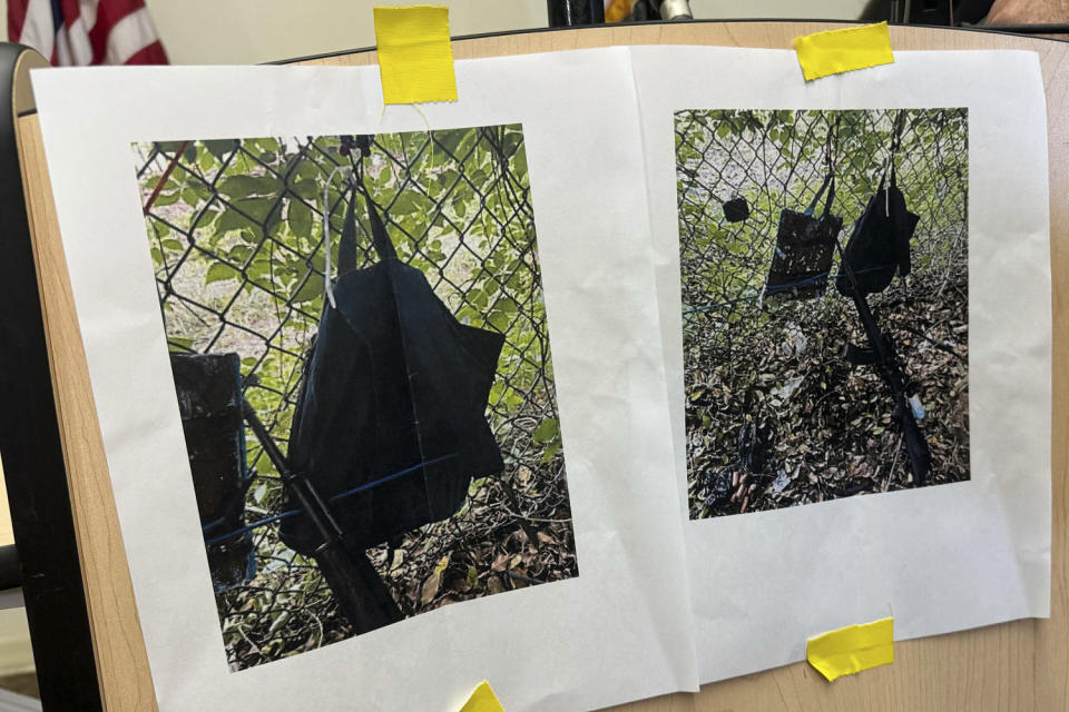 Photos show a weapon, a backpack and a GoPro camera on a fence outside Trump International Golf Club in West Palm Beach, Fla., taken after what authorities said was an apparent attempt to assassinate former President Donald Trump on Sunday.  (Stephany Matat / AP)