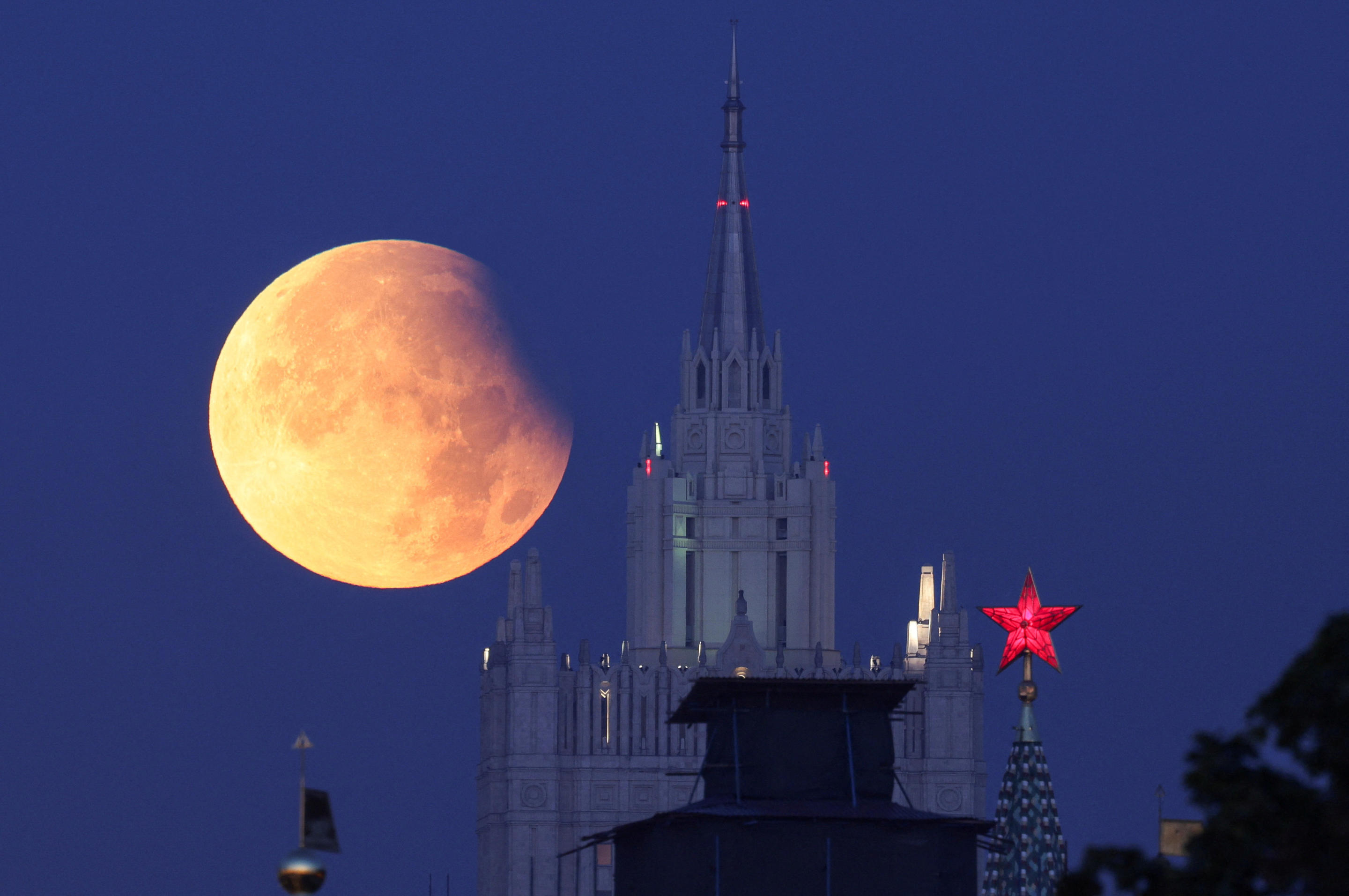 Partial lunar eclipse is seen near the Kremlin and Russia's Foreign Ministry headquarters in Moscow, Russia, Sept. 18. (Marina Lystseva/Reuters)