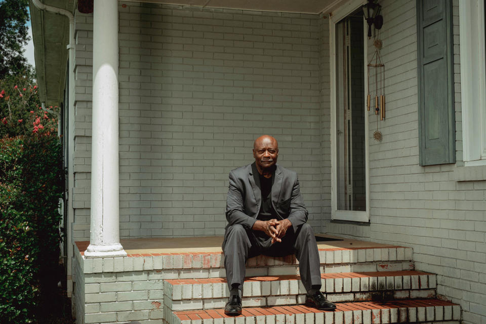 Terry Belk sits on the steps of his home (Mike Belleme for NBC News file)