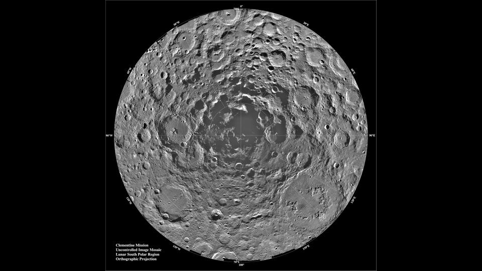 a photograph of the moon's south pole, showing numerous craters