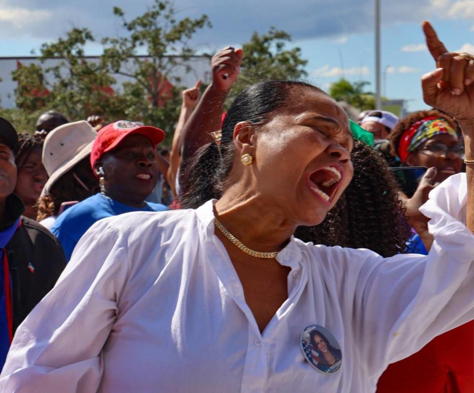 Activist and singer Farah Juste, left, joins in support of the South Florida Haitian community as Miami-Dade Democratic Haitian Caucus hosted a rally against the rhetoric of former President Donald Trump and running mate J.D. Vance, the importance of registration to vote, and participation in the election this November 5th on Sunday, September 22, 2024, in North Miami, Florida.