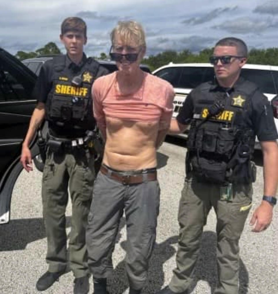 In this image released by the Martin County, Fla., Sheriff’s Office, police arrest Ryan Routh, the suspect in the apparent assassination attempt of Donald Trump, on Sept. 15. (Martin County Sheriff’s Office via AP)