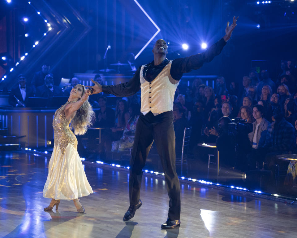 Pro dancer Daniella Karagach, left, and NBA star Dwight Howard dance onstage. 