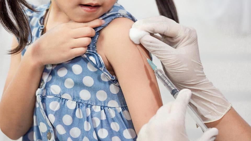 PHOTO: A child is given a flu shot. (Adobe Stock)