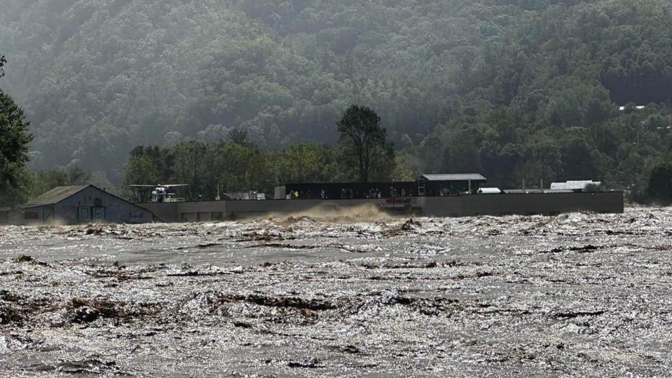 PHOTO: People are seen on the roof surrounded by floodwaters at Unicoi County Hospital in Erwin, Tenn., Sept. 27, 2024.  (Alderman Michael Baker)