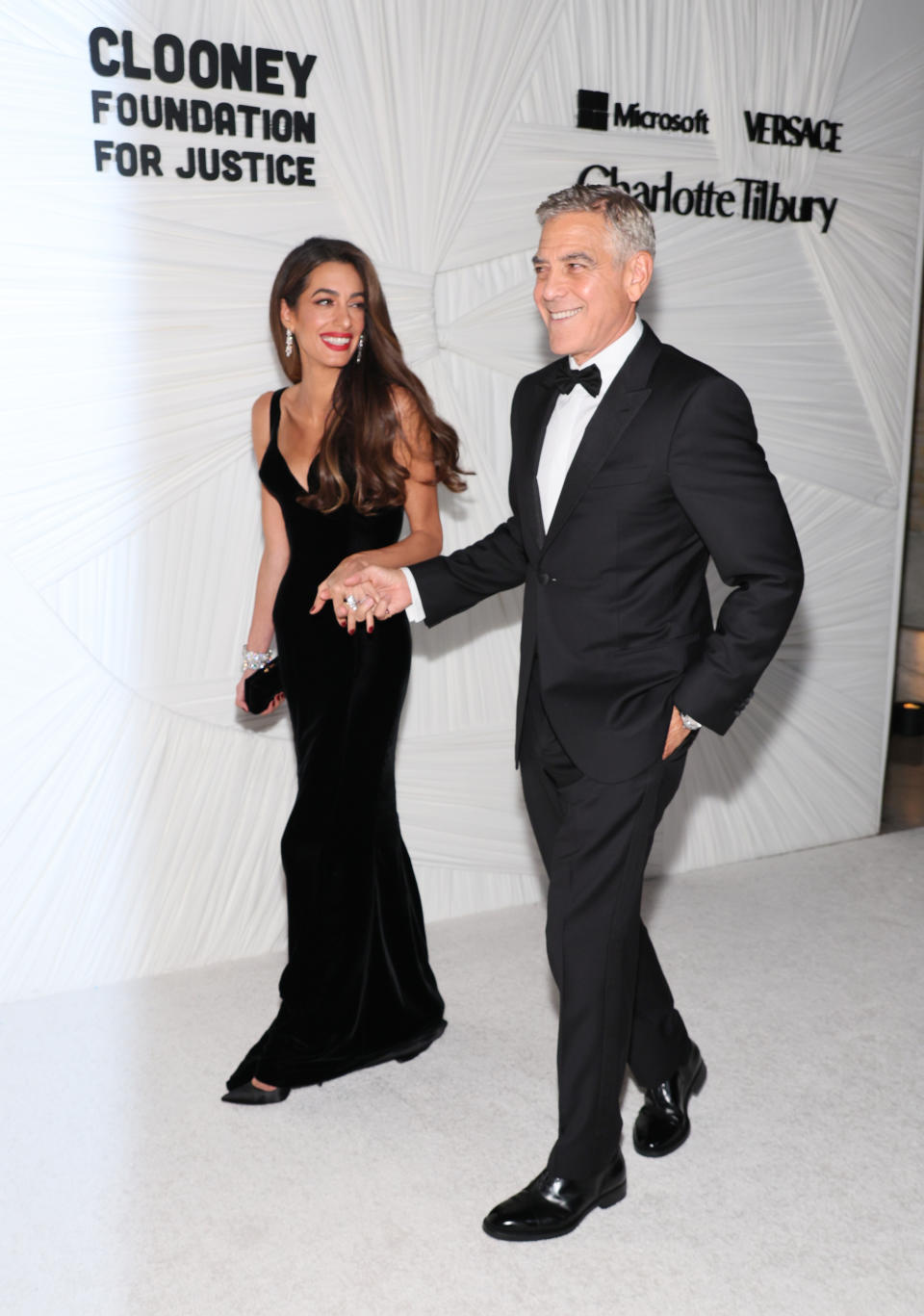 George and Amal Clooney wear black shoes at the Clooney Foundation for Justice's The Albies in New York City