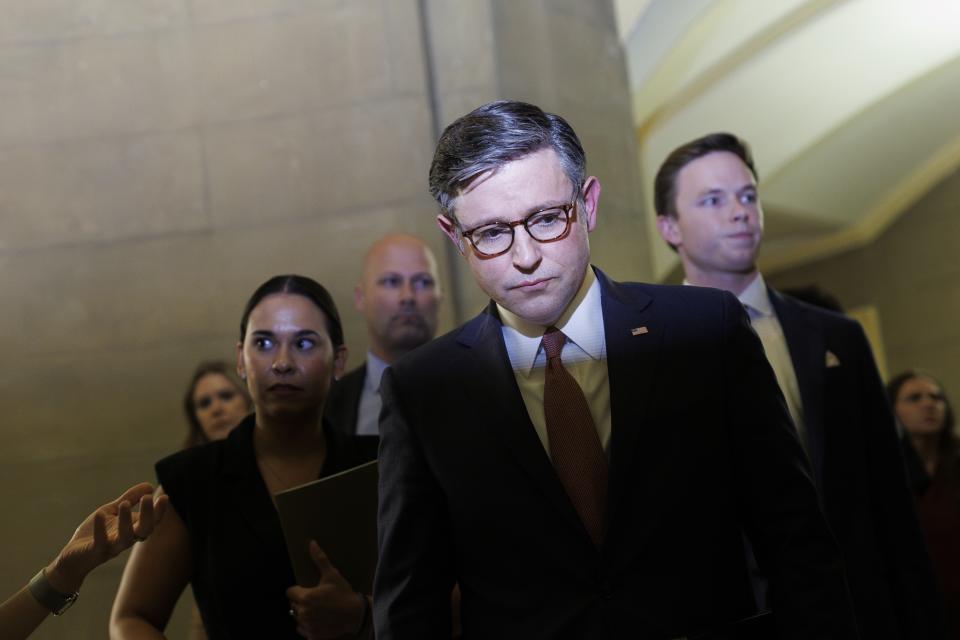 WASHINGTON, SEPTEMBER 25: 

House Speaker Mike Johnson (R-LA) speaks to journalists while walking to his office, after the House passed a stop-gap finding bill on Capitol Hill in Washington on September 25, 2024. (Photo by Tom Brenner for The Washington Post via Getty Images)