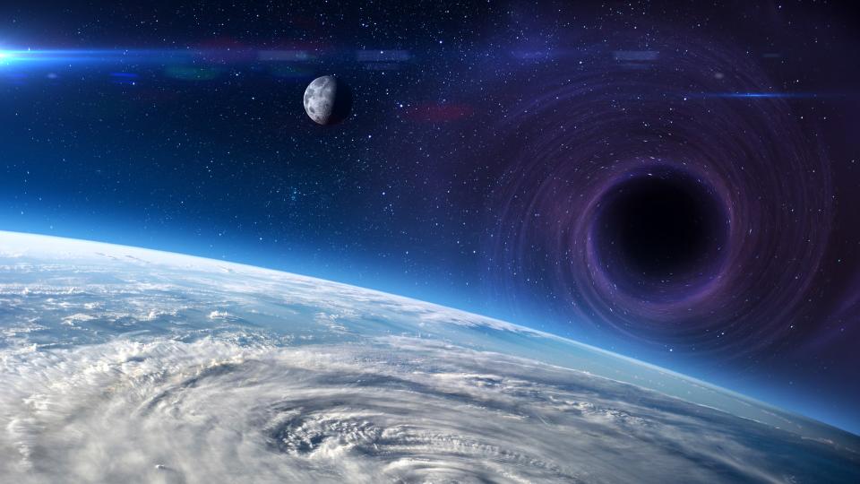  A large black orb can be seen in space between earth and the moon. 