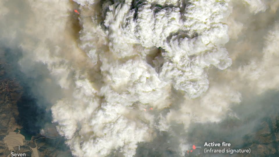 Satellite imagery captures the Line Fire's pyrocumulus clouds on Monday, September 9, 2024. Pink-ish and orange areas highlight active fire hot spots. - NASA