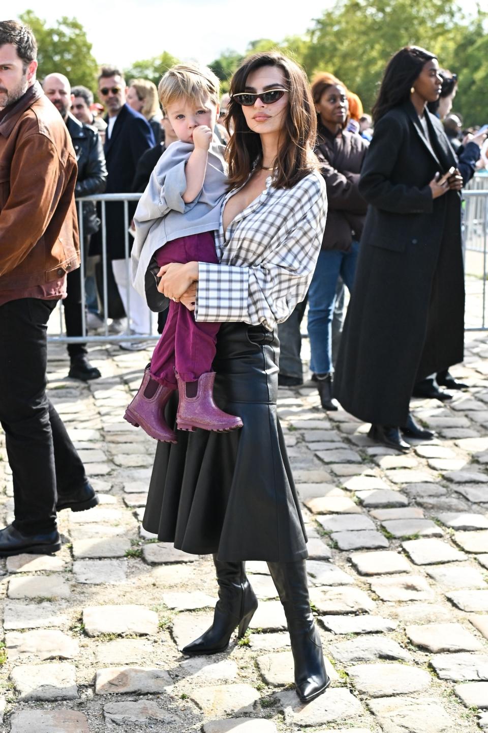 Emily Ratajkowski and son Sylvester Apollo Bear at the Loewe spring 2025 show during Paris Fashion Week on September 27. 