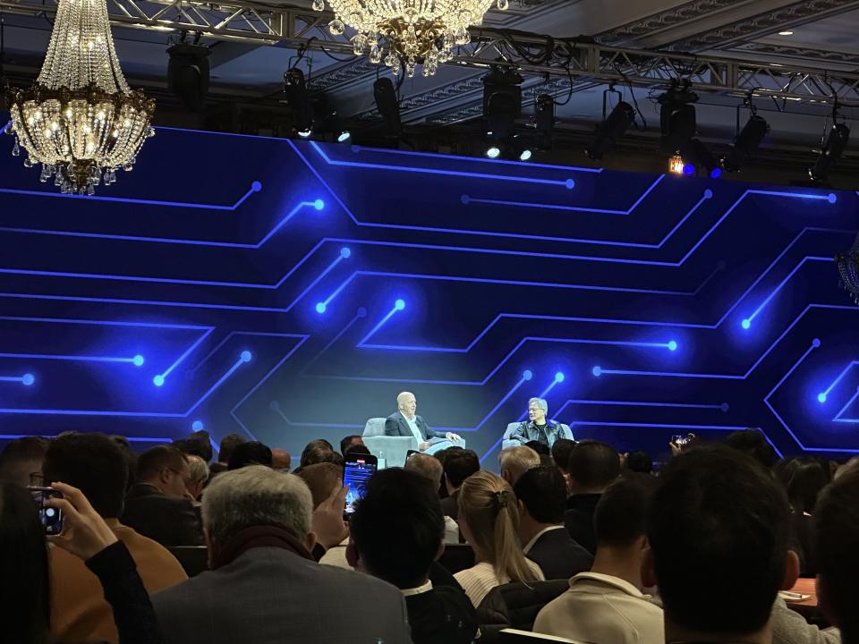 Nvidia CEO Jensen Huang speaking on stage with Goldman Sachs CEO David Solomon at the Goldman Sachs Communacopia & Technology Conference in San Francisco. 
