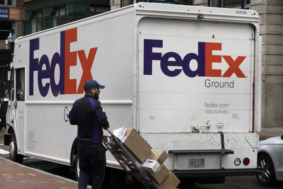 A FedEx driver makes deliveries in Boston. (AP Photo/Michael Dwyer)