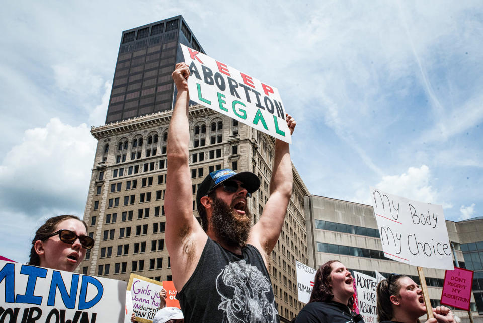 Protesters hold signs at a protest, main sign reads "Keep Abortion Legal" (Whitney Saleski / SOPA Images / LightRocket via Getty Images file)