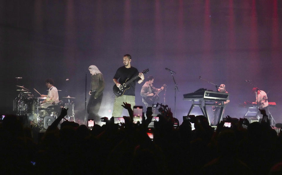 Colin Brittain, Armstrong, Dave Farrell, Alex Feder (filling in for guitarist Brad Delson), Joe Hahn and Shinoda of Linkin Park perform onstage.