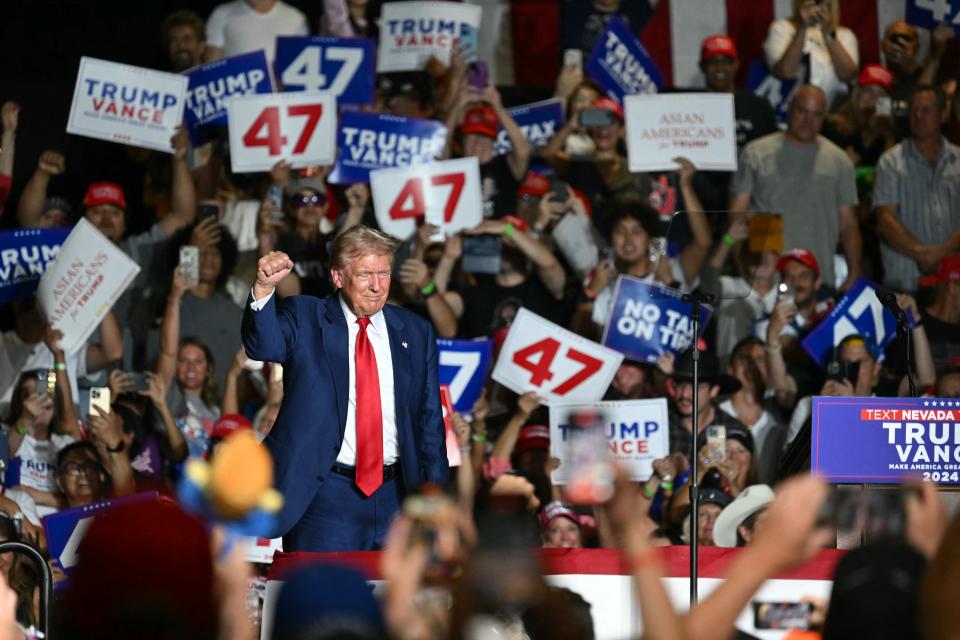 TOPSHOT - Former US President and Republican presidential candidate Donald Trump raises a fist on stage during a campaign rally at the Expo World Market Center in Las Vegas, Nevada, on September 13, 2024. (Photo by Patrick T. Fallon / AFP) (Photo by PATRICK T. FALLON/AFP via Getty Images)