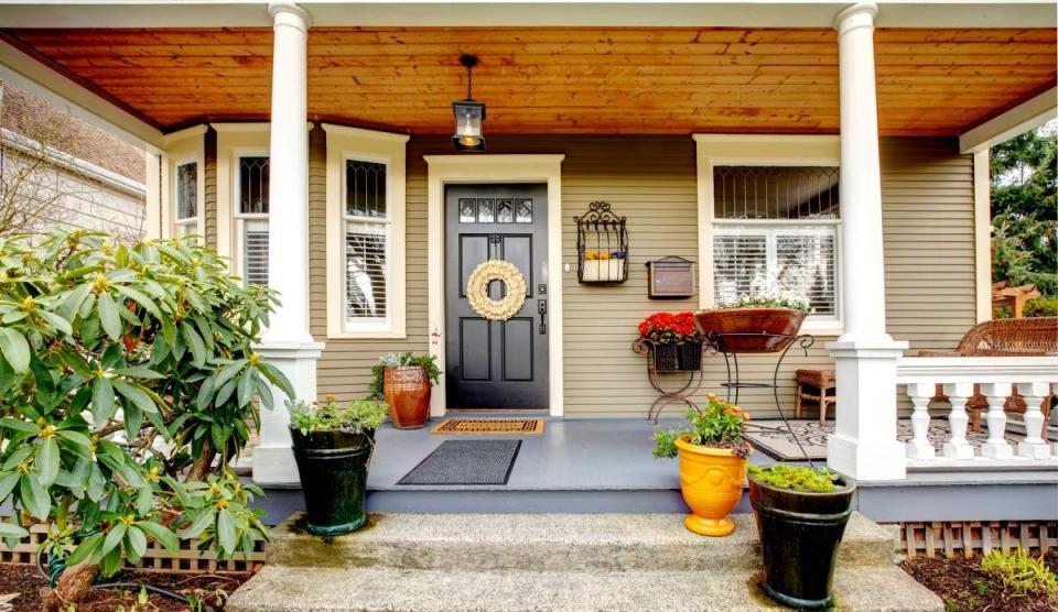 front porch of a small two story home