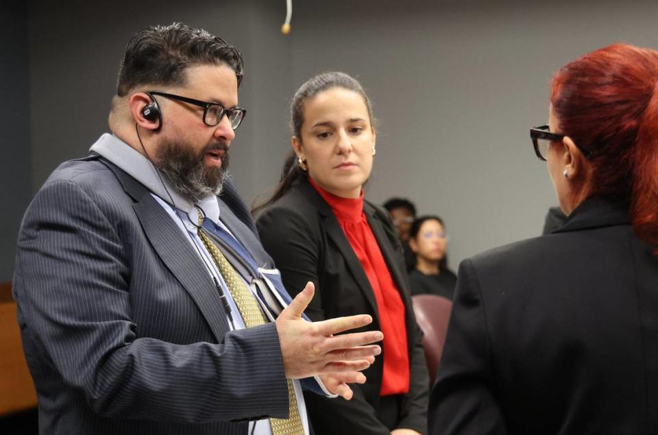 Kadel Piedrahita, who is accused of shooting and killing a cyclist on the Rickenbacker Causeway in August 2019, talks to his attorneys during his trial in Courtroom 7-2 inside the Richard E. Gershwin Justice Building on Thursday, September 5, 2024, in Miami, Florida.