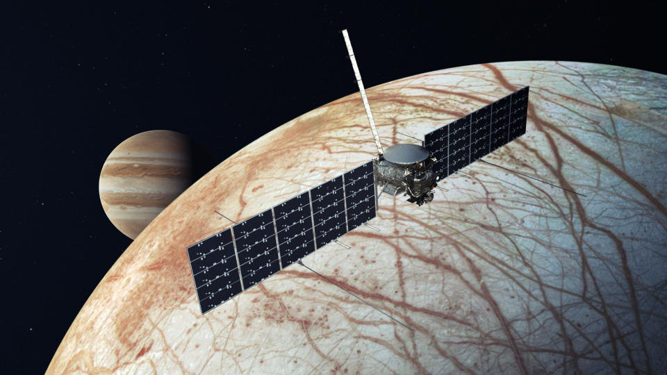  A spacecraft over Europa, Jupiter is in the background. 