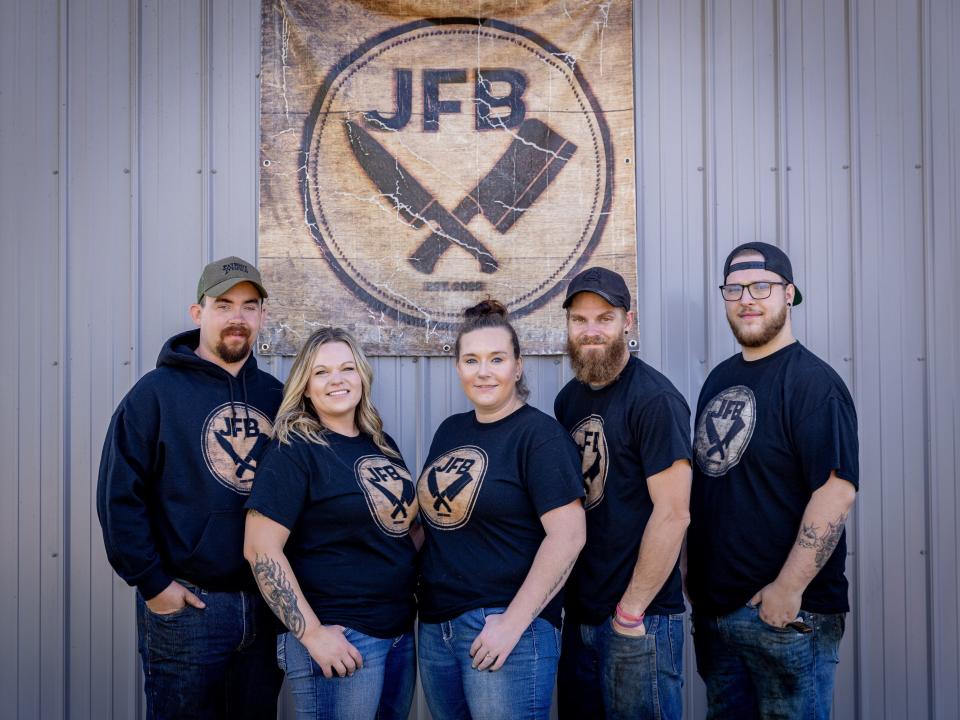 Matt Juengers, Lindsey Juengers, Codi Renmoe, Chris Renmoe and Isiah Kiefer stand in front of Juengers Butcher Shop in Watertown.