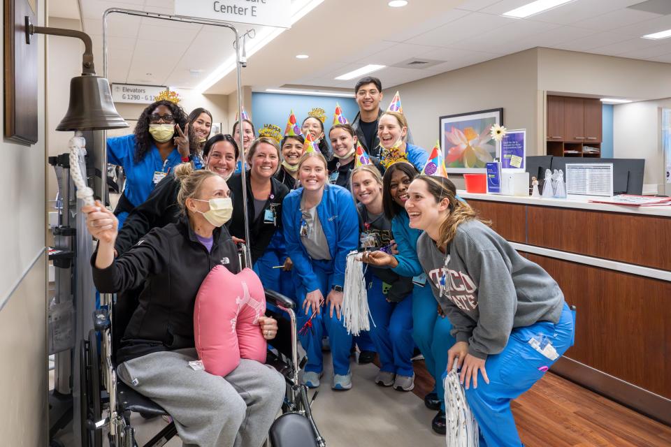 Mandy Wilk ringing the stepdown transplant bell at Northwestern Medicine on June 10, 2024.