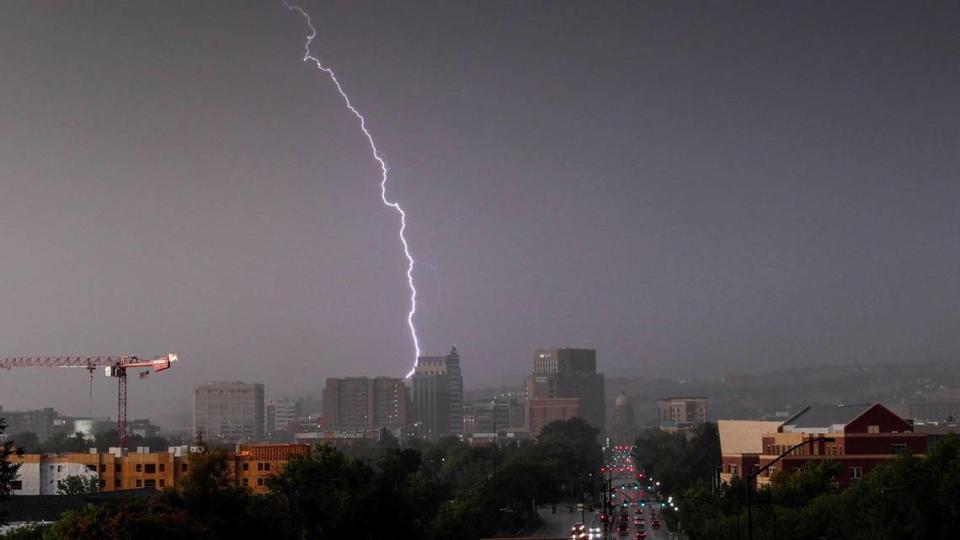 A bolt of lightning strikes over the downtown Boise skyline as a severe thunderstorms rolled through the Treasure Valley in August 2023.