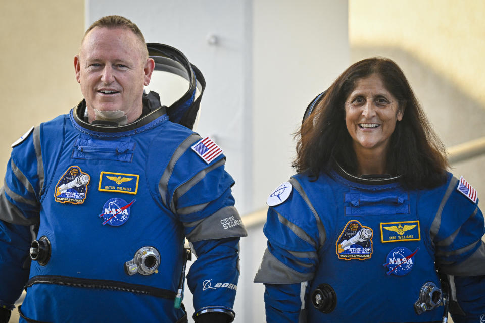 NASA astronauts  Butch Wilmore (L) and Suni Williams, wearing Boeing spacesuits,  depart the Neil A. Armstrong Operations and Checkout Building at Kennedy Space Center for Launch Complex 41 at Cape Canaveral Space Force Station in Florida to board the Boeing CST-100 Starliner spacecraft for the Crew Flight Test launch, on June 5, 2024. Boeing on June 5 will try once more to launch astronauts aboard a Starliner capsule bound for the International Space Station. Liftoff is targeted for 10:52 am (1452 GMT) for a roughly one-week stay at the orbital laboratory. (Photo by Miguel J. Rodriguez Carrillo / AFP) (Photo by MIGUEL J. RODRIGUEZ CARRILLO/AFP via Getty Images)