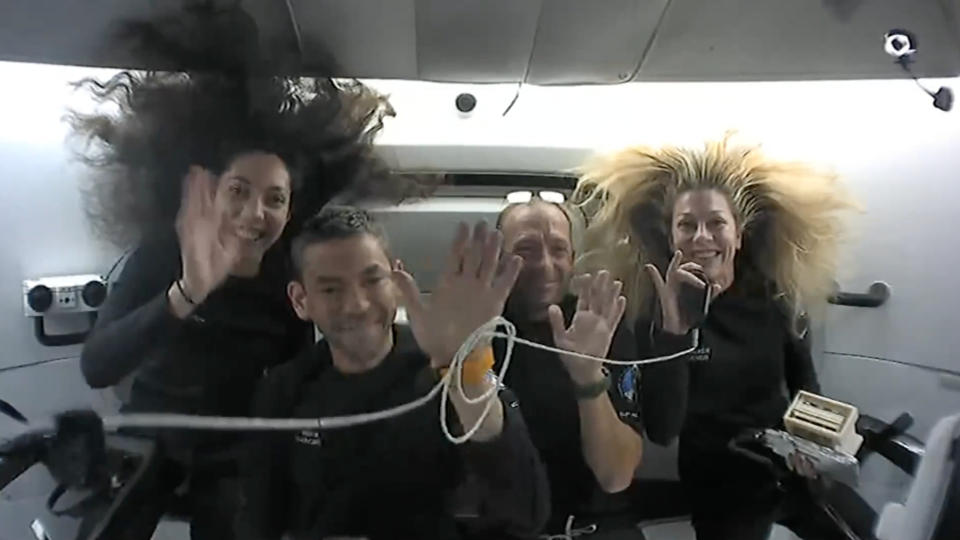  The four private Polaris Dawn astronauts wave during a video downlink from their SpaceX Dragon capsule on Sept. 13, 2024. 