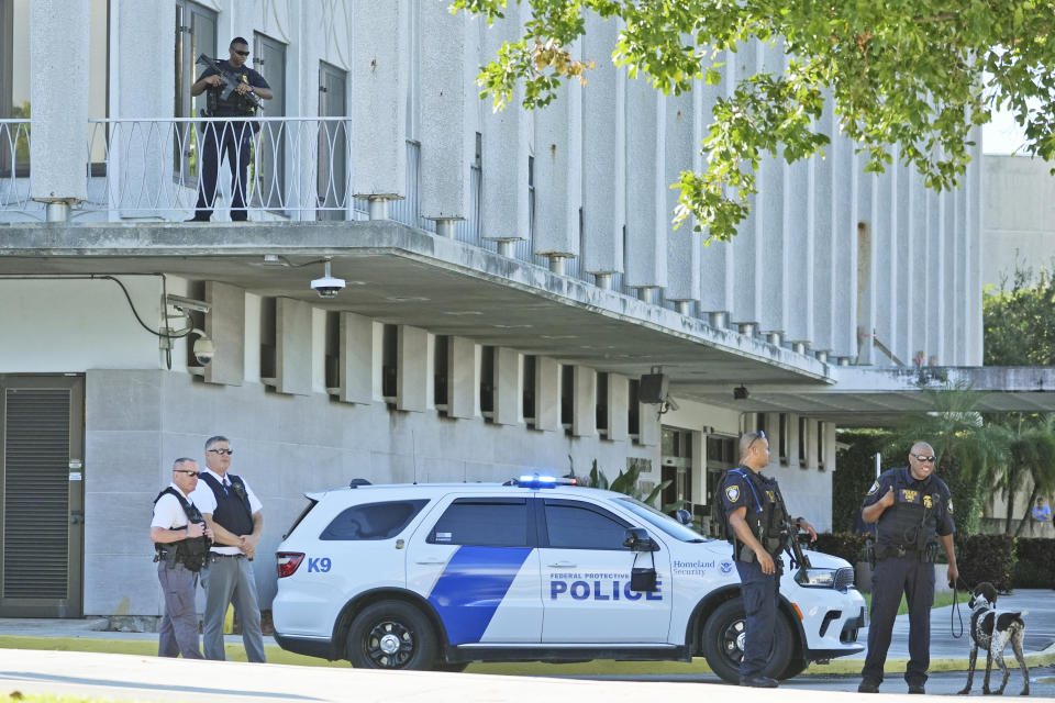 Law enforcement officers patrol outside the federal courthouse in West Palm Beach, Fla., Monday. (Wilfredo Lee/AP)