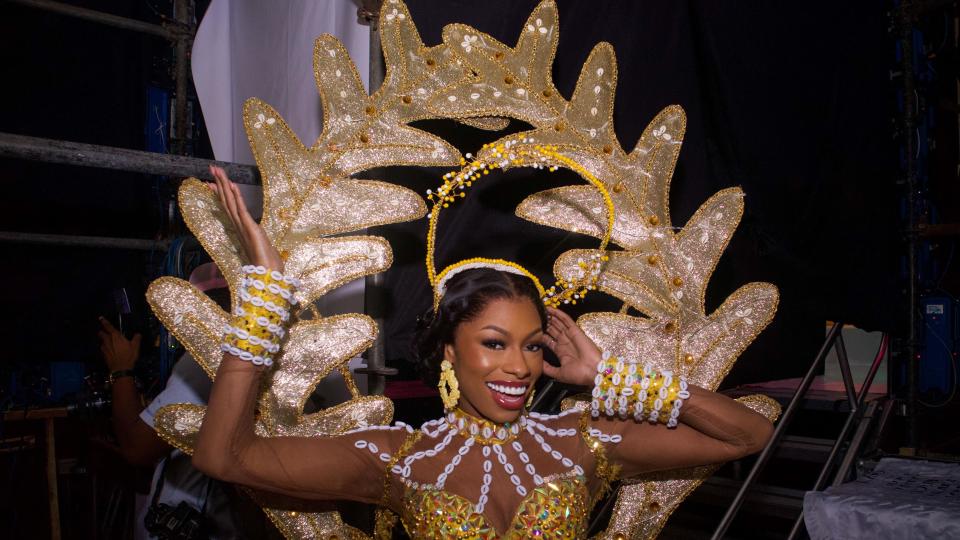 An image of a Miss Universe contestant wearing a gold and white outfit backstage in Lagos, Nigeria - Saturday 31 August 2024