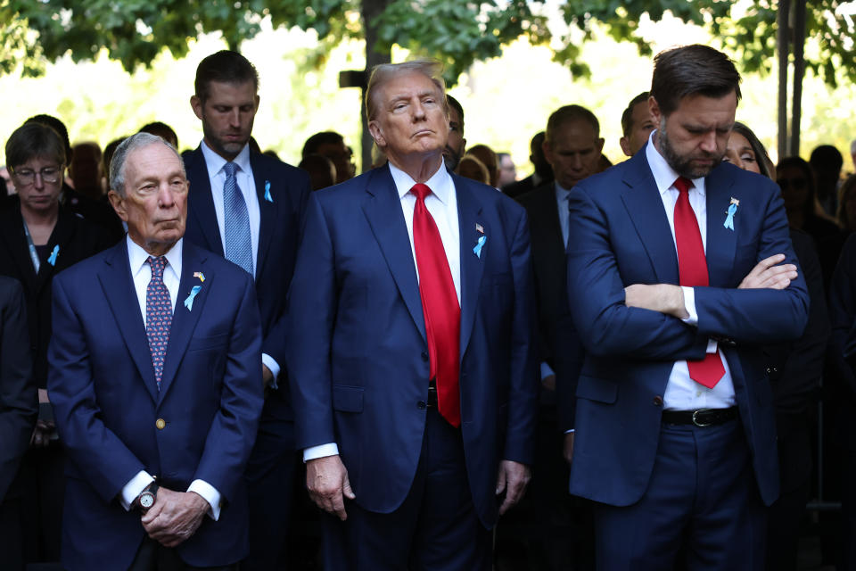 NEW YORK, NEW YORK - SEPTEMBER 11: Former NYC Mayor Michael Bloomberg, former U.S. President Donald Trump and Republican vice presidential nominee, and U.S. Sen. J.D. Vance (R-OH) attend the annual 9/11 Commemoration Ceremony at the National 9/11 Memorial and Museum on September 11, 2024 in New York City. U.S. President Joe Biden, Democratic presidential nominee, U.S. Vice President Kamala Harris, Republican presidential nominee, former U.S. President Donald Trump and Republican vice presidential nominee, U.S. Sen. J.D. Vance (R-OH) joined family and friends at Ground Zero honoring the lives of their loved ones on the 23rd anniversary of the terror attacks of September 11, 2001, at the World Trade Center. Biden and Harris will also attend ceremonies at the Flight 93 National Memorial in Shanksville, Pa, and the Pentagon in Arlington, Va., making visits to all three sites of the terror attacks that killed nearly 3,000 people.  (Photo by Michael M. Santiago/Getty Images)