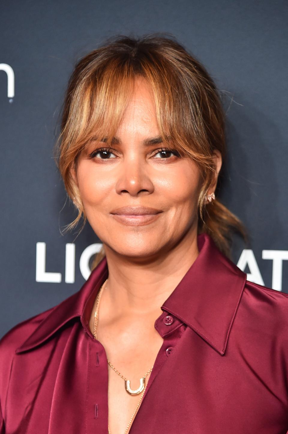 Halle Berry at a 2024 convention in Los Vegas with curtain bangs.