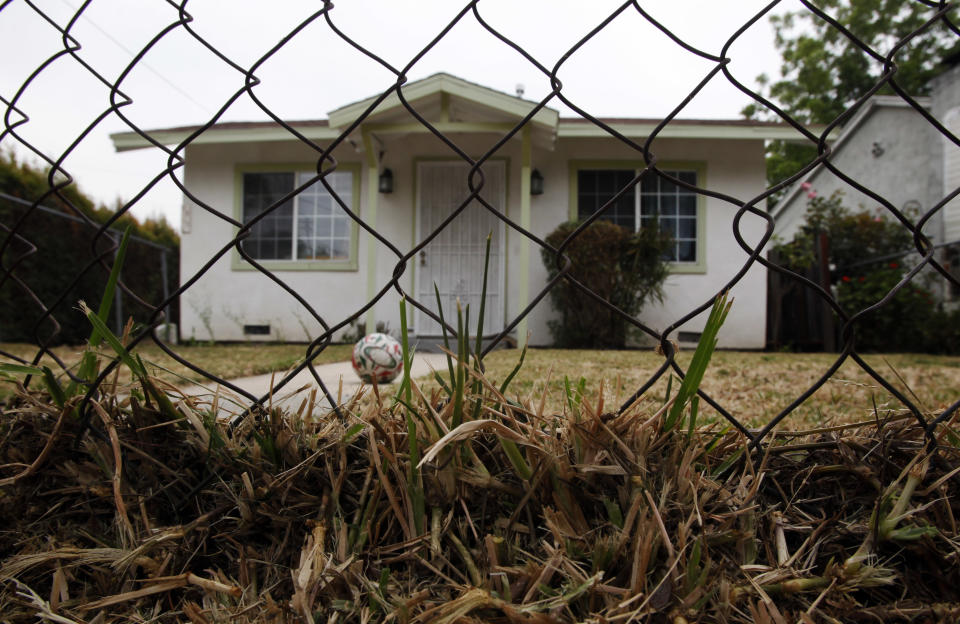 A home that is listed as in foreclosure in seen in Los Angeles Thursday, June 9, 2011. (AP Photo/Reed Saxon)