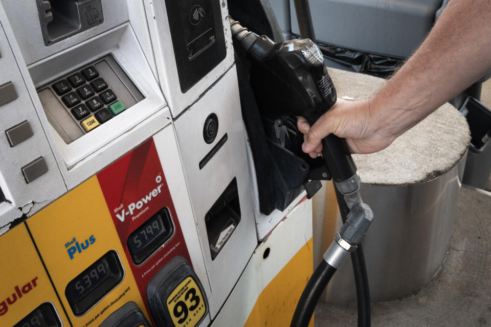 CHICAGO, ILLINOIS - JUNE 11: A customer purchases gas at a station on June 11, 2024 in Chicago, Illinois. Despite gas prices in Chicago close to $5-per-gallon, nationwide the average price was $3.44 as of Monday, 14 cents less than last year, according to the AAA auto club.  (Photo by Scott Olson/Getty Images)