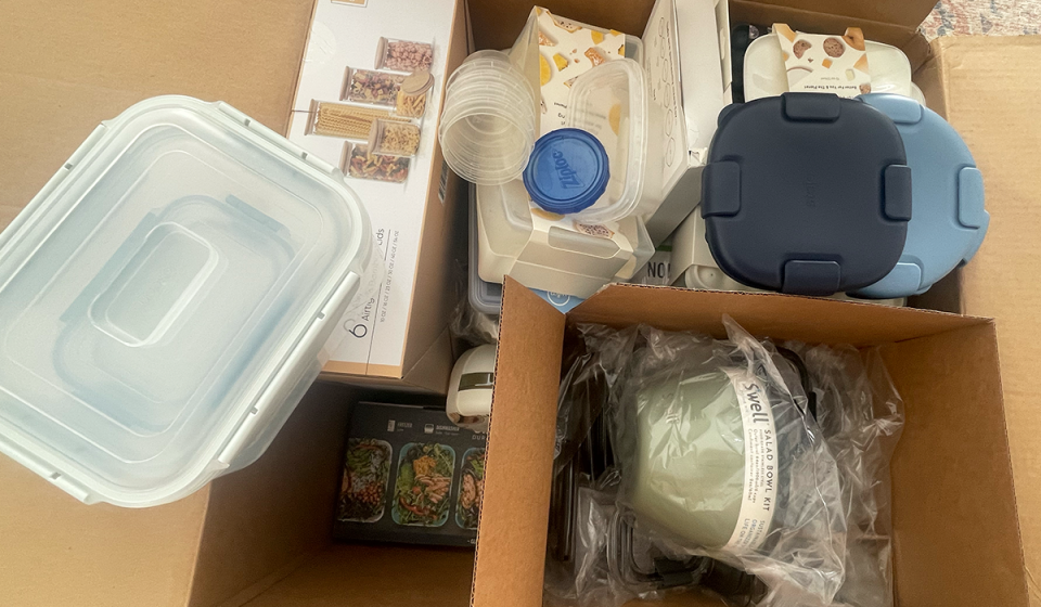 A box filled with different food storage containers to be tested for Yahoo's best food storage guide