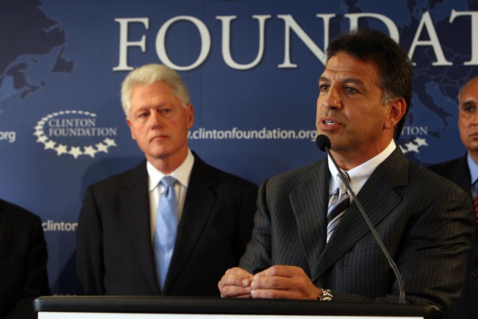 Former US President Bill Clinton listens as Robert Coury (R), CEO of Mylan Labs, speaks at a news conference held in August 2009 at Clinton Foundation headquarters in New York City about a recent new initiative to treat AIDS patients in developing countries. Much progress has been made in the fight against HIV/AIDS, but organizers of AIDS walks say many challenges remain decades later.