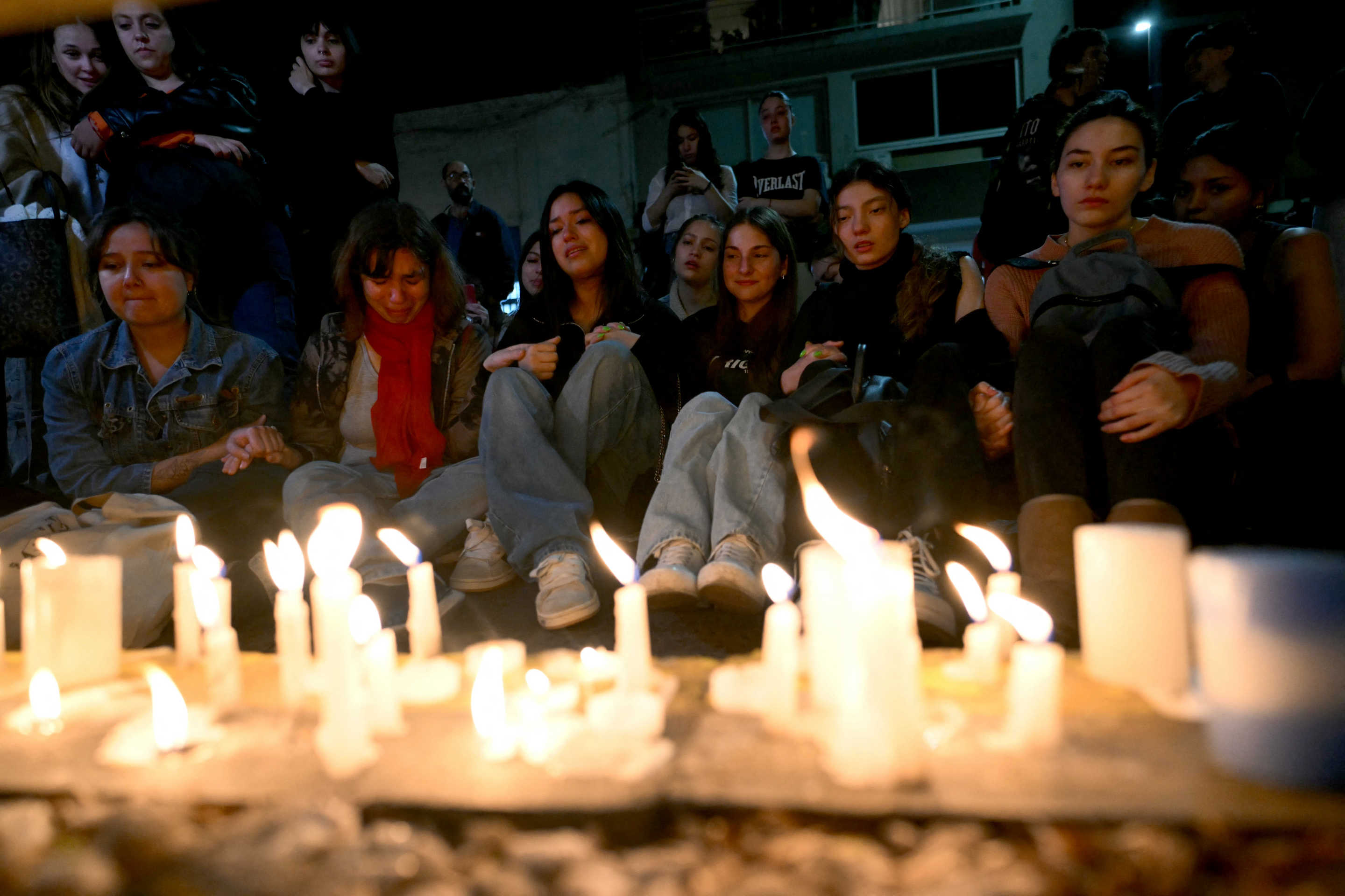 Fans of British singer Liam Payne lit candles next to the hotel where he died in Buenos Aires on October 16, 2024. (Luis Robayo/AFP via Getty Images)