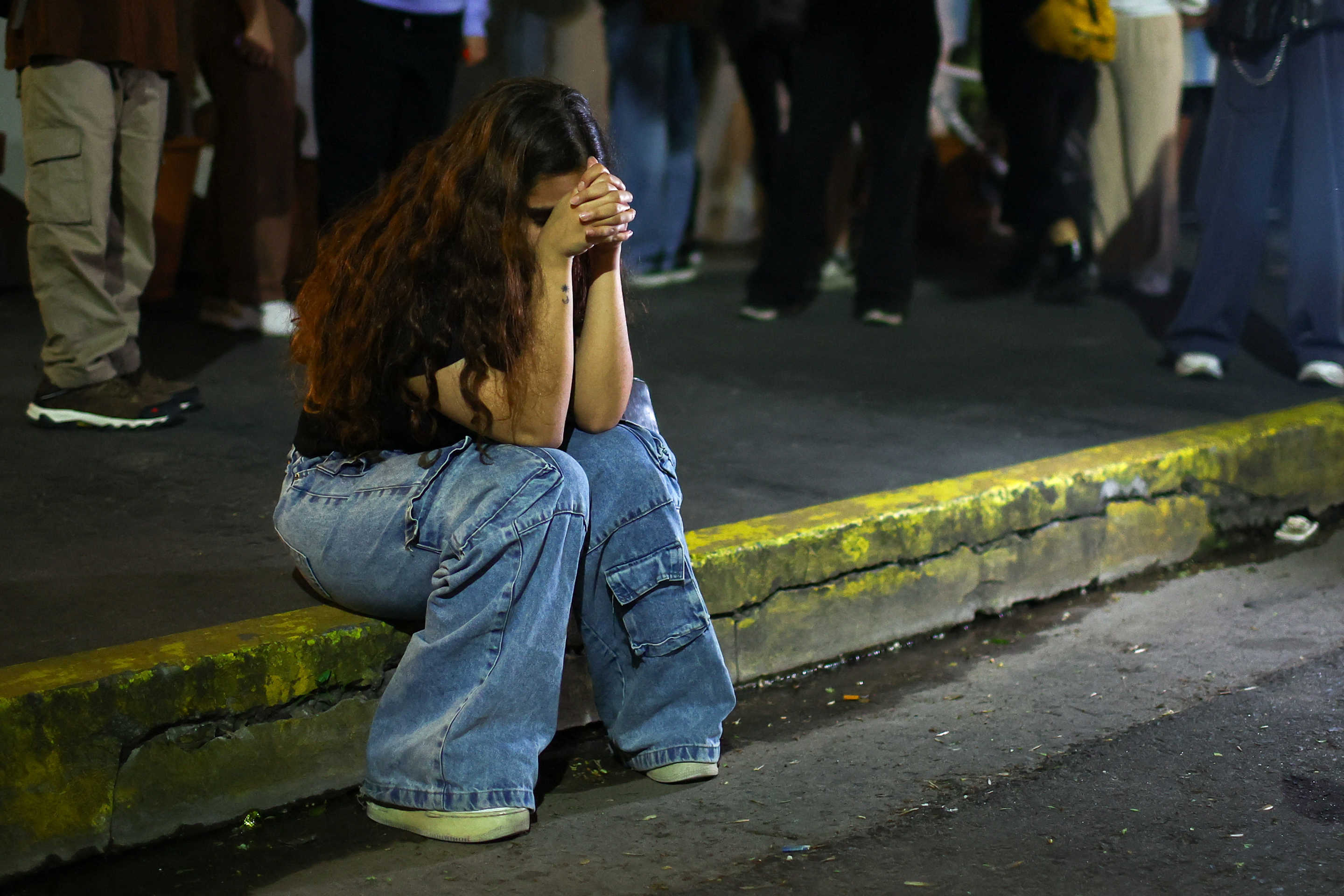 A fan reacts outside the hotel where Liam Payne was found dead, in Buenos Aires on Wednesday.