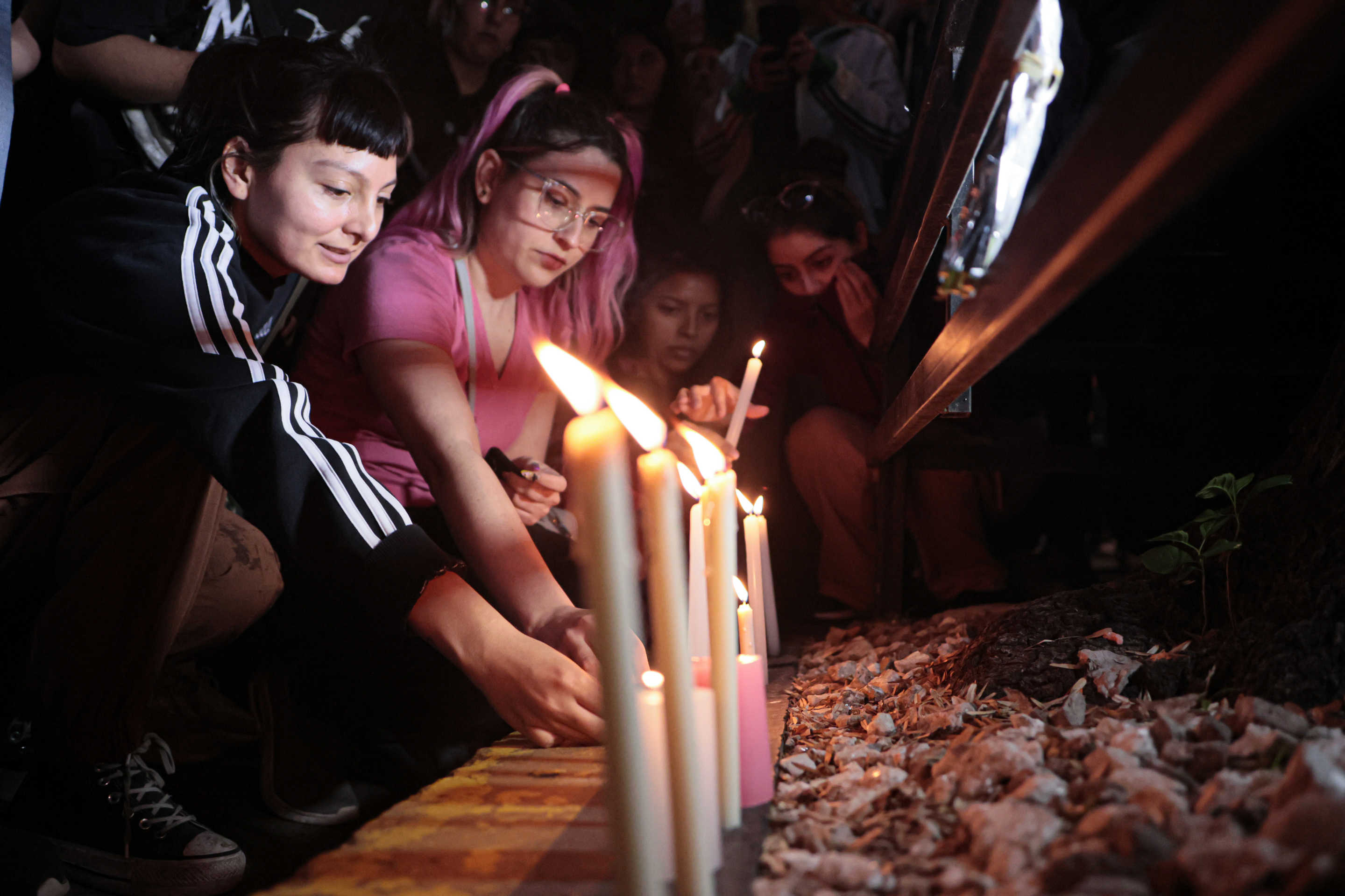 Fans of One Direction and Liam Payne leave candles at an improvised altar on Wednesday.