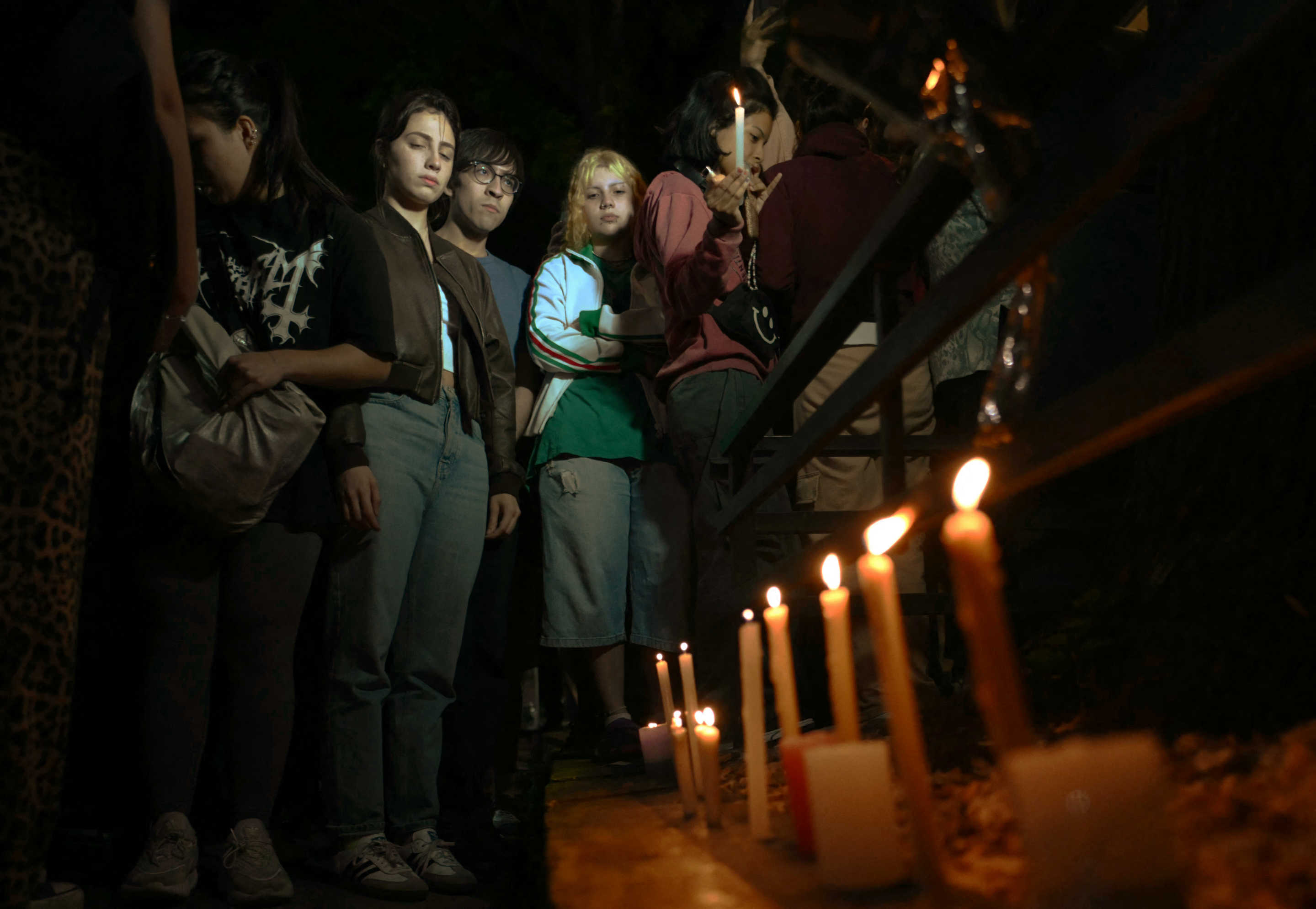 Fans of British singer Liam Payne lit candles next to the hotel where he died in Buenos Aires on October 16, 2024. (Luis Robayo/AFP via Getty Images)