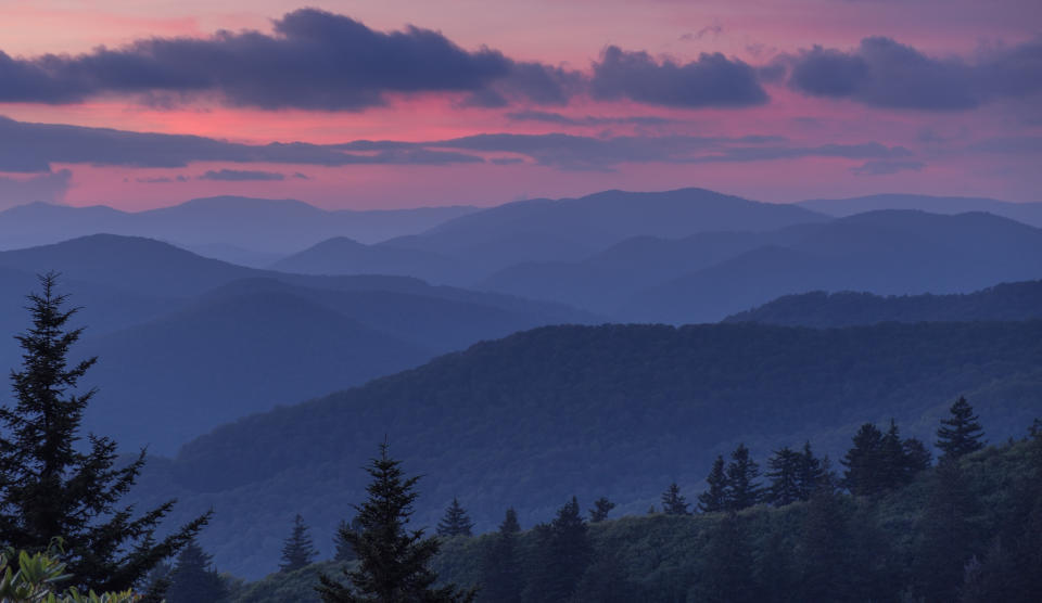 Clouds hover above the Smoky Mountains at sunset