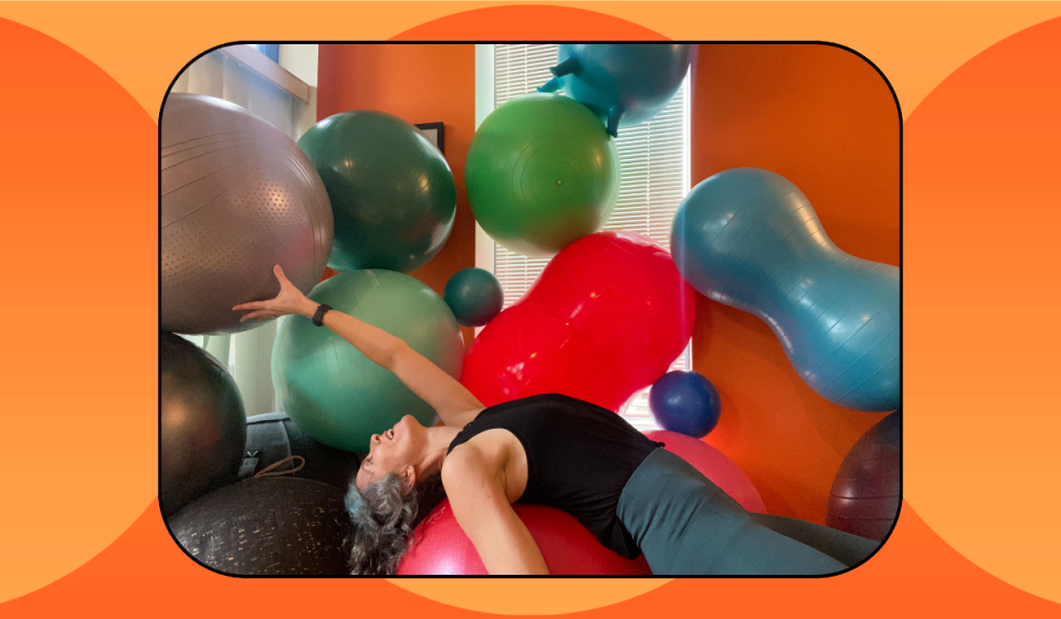 Author with a pile of exercise balls