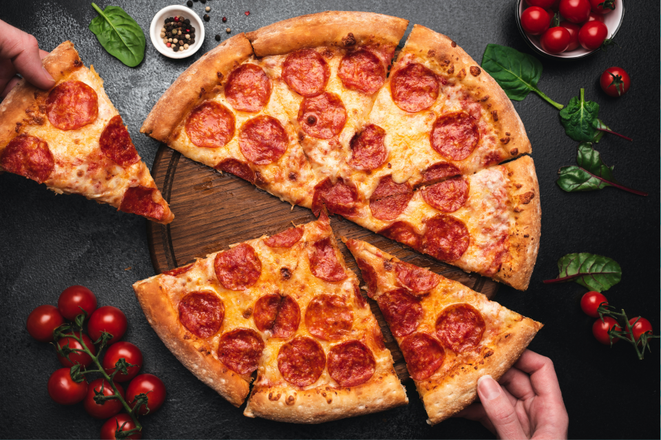 Pizza scissors cut your pie into clean slices without the toppings sliding off. (Getty)