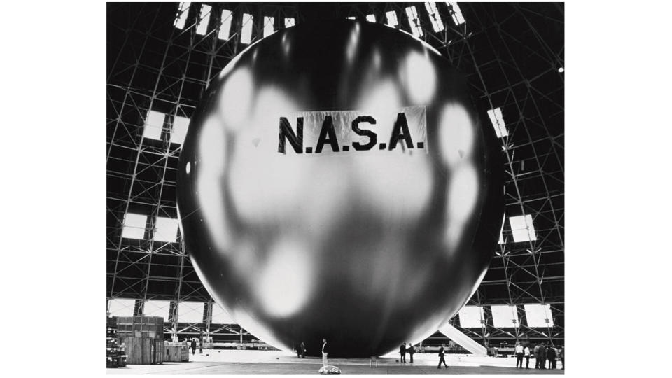 black and white photo of a huge shiny balloon with 