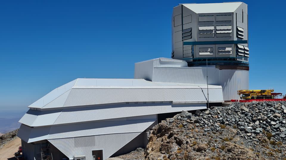 This view of the observatory shows the enclosed dome on the right and the support building on the left. A total of 420 people and 28 countries were involved in the construction, which started in 2015. - Rubin Obs/NSF/AURA