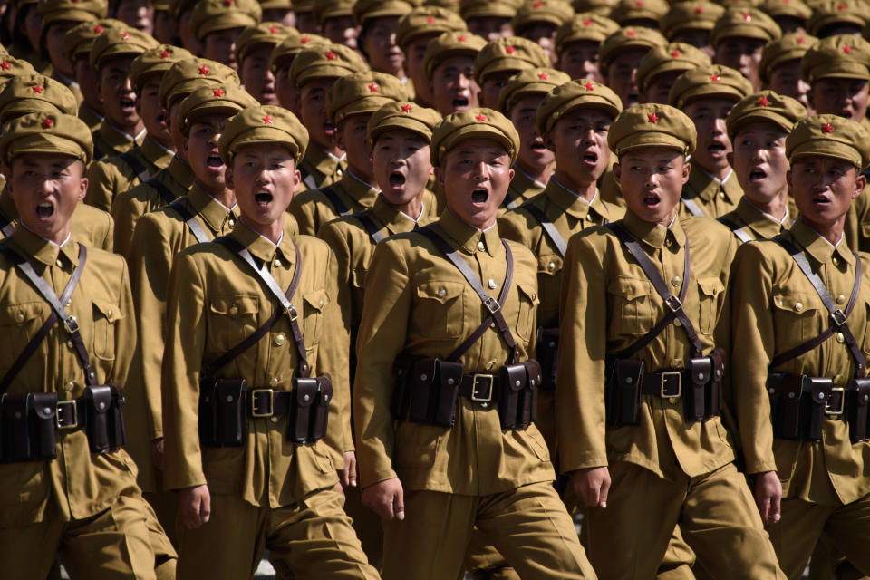 Dozens of North Korean soldiers in neat rows.