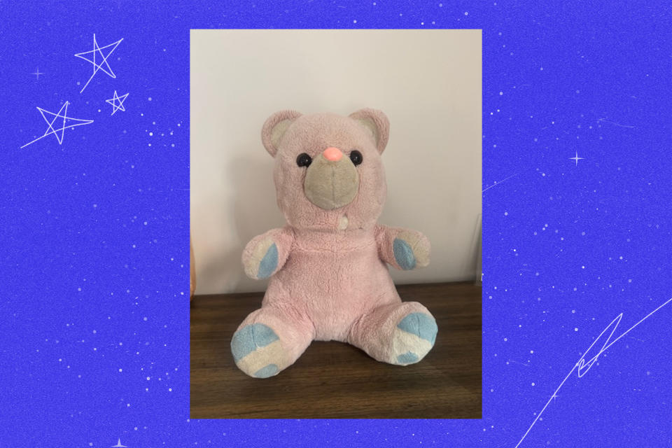 Pink Bear, a well-worn pink stuffed bear.