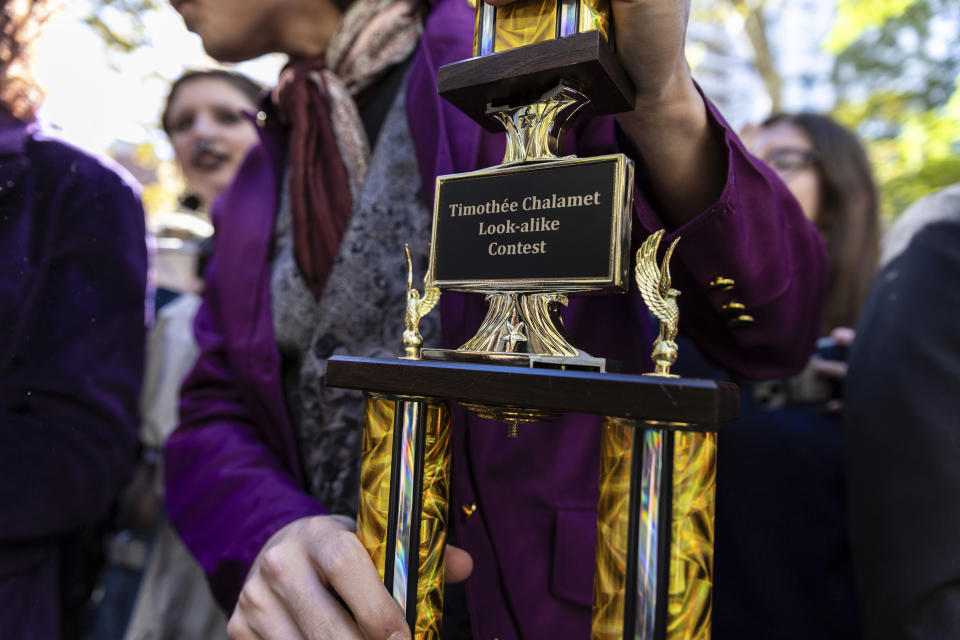 Mitchell, winner of the contest, holds his trophy.