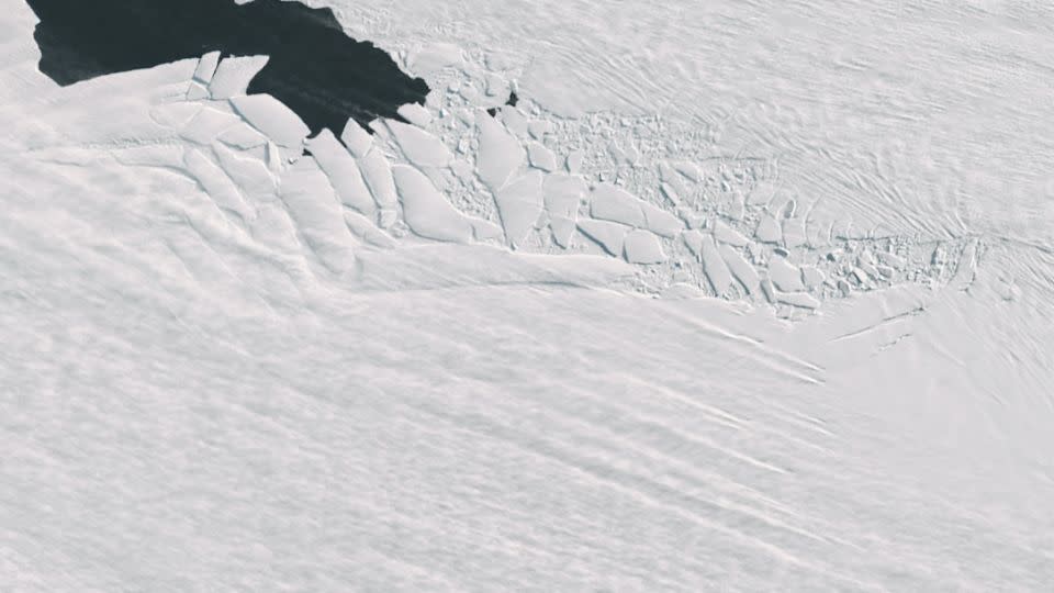 Strong winds blow snow into stark lines across Pine Island Glacier. - NASA/USGS